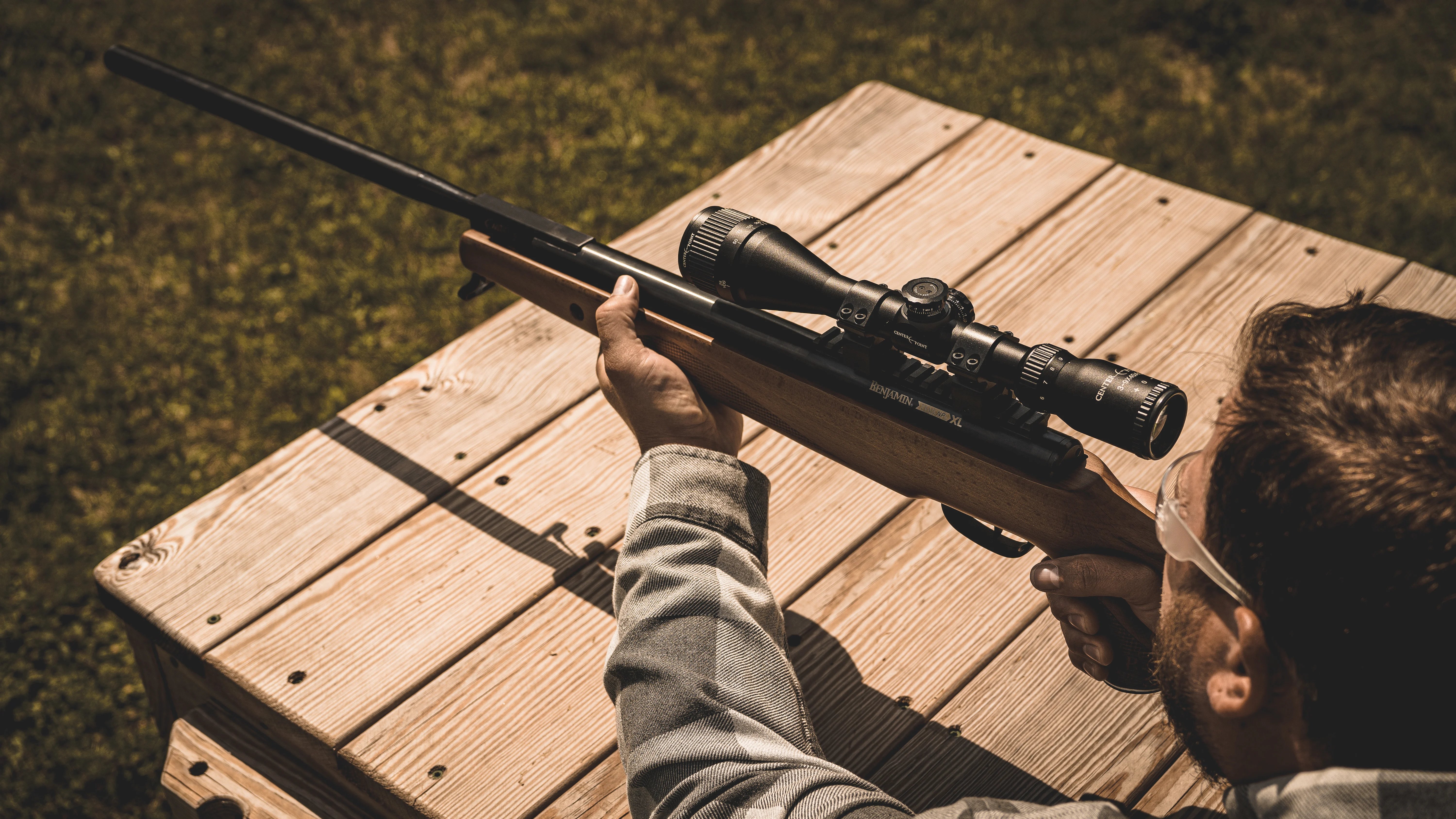 A hunter aiming a Benjamin break barrel air rifle